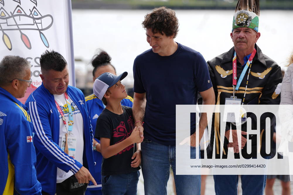 Prime Minister Justin Trudeau, second from right, shakes hands with his son Hadrien as they join chiefs and other dignitaries prior to the Canoe Kayak competition at the North American Indigenous Games 2023 in Halifax, Monday, July 17, 2023. Halifax Canada - ZUMAc35_ 20230717_zaf_c35_072