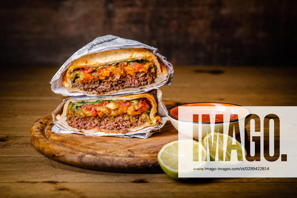 Hamburger or sandwich Hamburger or sandwich, beef torta with salsa dip and guacamole. Mexican cuisine.