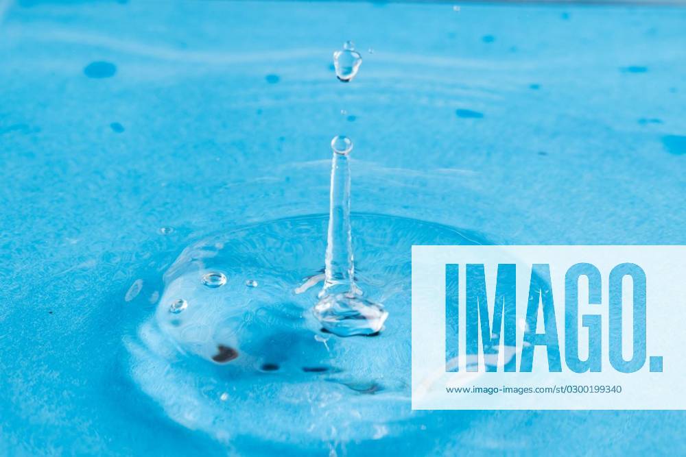 Close up of water drop falling into water with ripples and copy space on blue background Close up of water drop falling into water with ripples and copy space on blue background. Water, liquid and colour concept., model released, , property released, Cape Town, South Africa, 2023-06-07T22:00:00.000Z, 4132833.jpg, close,water drop,falling water,ripple,copy space,blue background,liquid,colour,concept,drop,splash,abstract,design,background,wet,flow,fluid,closeup,wave,illustration,macro,business,graphic,symbol,isolated,flowing,color,clean,drink,water,falling,copy,space,blue