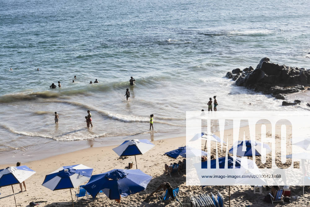 Beach scene on a busy spring day with people at leisure at Farol da Barra beach in Salvador, Brazil. Salvador Bahia Brazil