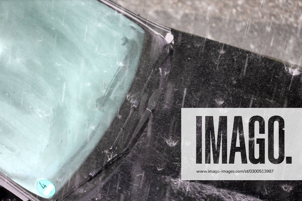 Dangerous road conditions during heavy rain Heavy rain pelts a car and the suddenly fogged window takes away all visibility