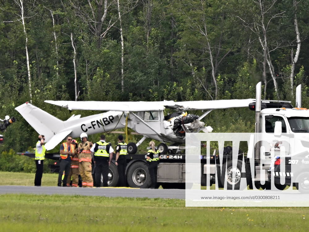 A Cessna 152 aircraft is towed away after it crashed on landing at the Jean-Lesage Airport on Tuesday, Aug. 1, 2023 in Quebec City. One person was reported injured. QUEBEC CITY Canada - ZUMAc35_ 20230801_zaf_c35_025