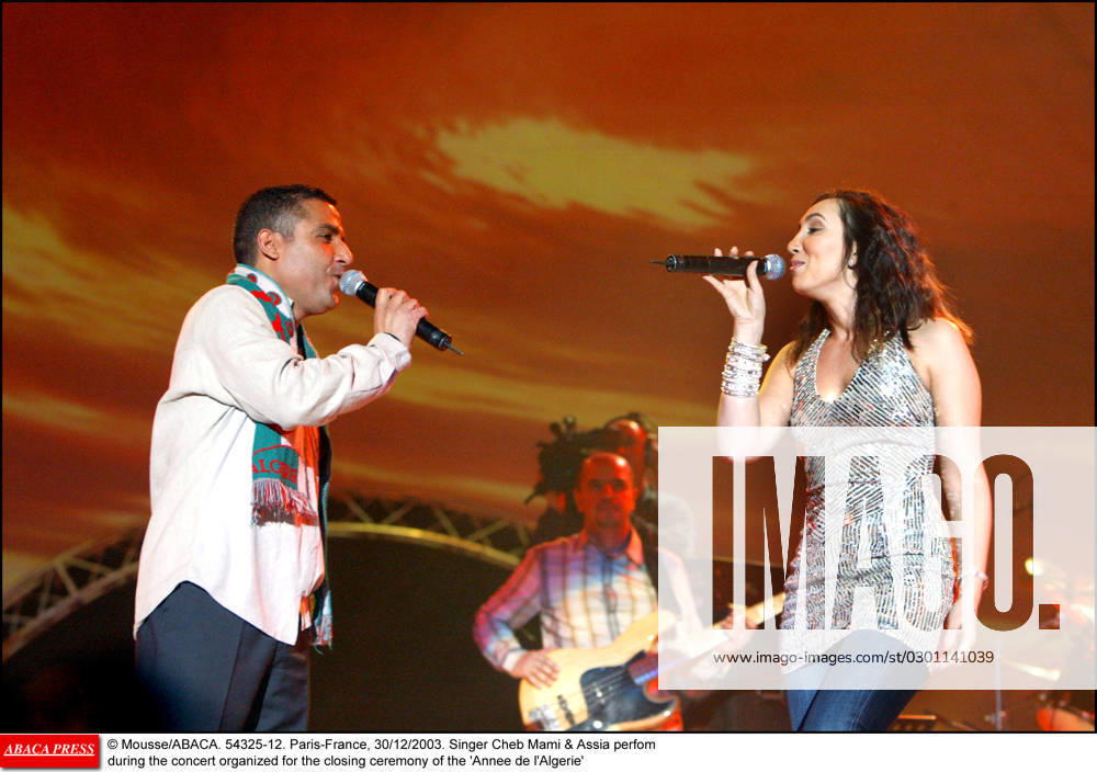 54325 12 Mousse ABACA. 54325-12. Paris-France, 30 12 2003. Singer Cheb Mami & Assia perfom during the concert organized for the closing ceremony of the Annee de l Algerie