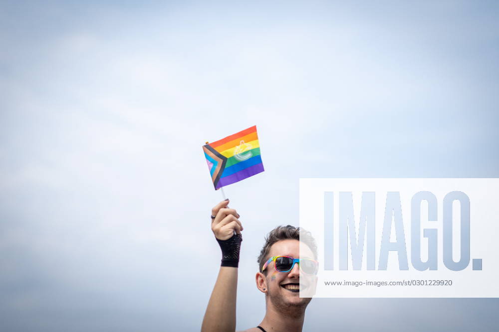 A person is seen waving a pride flag during the Pride Parade at English Bay in Vancouver, B.C., Sunday, Aug. 6, 2023. VANCOUVER CANADA - ZUMAc35_ 20230806_zaf_c35_007