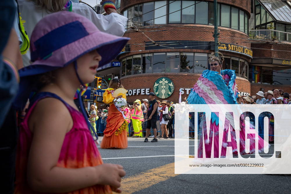 A young girl watches as drag performers pass during the Pride Parade at English Bay in Vancouver, B.C., Sunday, Aug. 6, 2023. VANCOUVER CANADA - ZUMAc35_ 20230806_zaf_c35_008