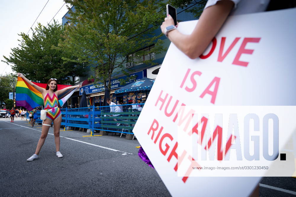A person poses for a picture in the street during the Pride Parade at English Bay in Vancouver, B.C., Sunday, Aug. 6, 2023. VANCOUVER CANADA - ZUMAc35_ 20230806_zaf_c35_011