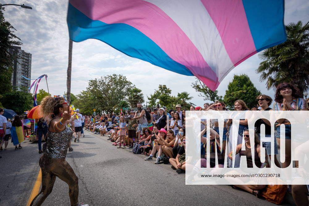 A person waves a trans pride flag during the Pride Parade at English Bay in Vancouver, B.C., Sunday, Aug. 6, 2023. VANCOUVER CANADA - ZUMAc35_ 20230806_zaf_c35_013