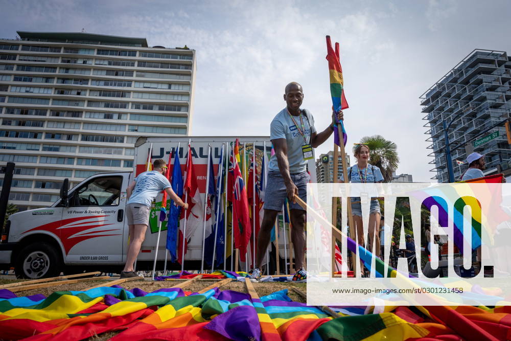 Volunteers organize flags before the Pride Parade at in Vancouver, B.C., Sunday, Aug. 6, 2023. VANCOUVER CANADA - ZUMAc35_ 20230806_zaf_c35_018