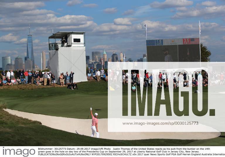 Justin Thomas of the United States reacts as his putt from the bunker on the 14th green goes in the hole on day two of the Presidents Cup on September 29, 2017 at Liberty National Golf Club in Jersey City, New Jersey. NYP20170929502 RICHxSCHULTZ