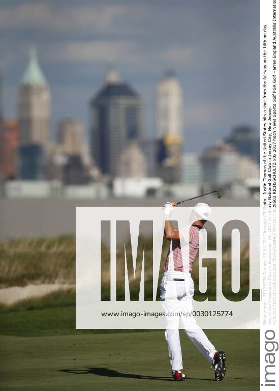 Justin Thomas of the United States hits a shot from the fairway on the 14th on day two of the Presidents Cup on September 29, 2017 at Liberty National Golf Club in Jersey City, New Jersey. NYP20170929503 RICHxSCHULTZ