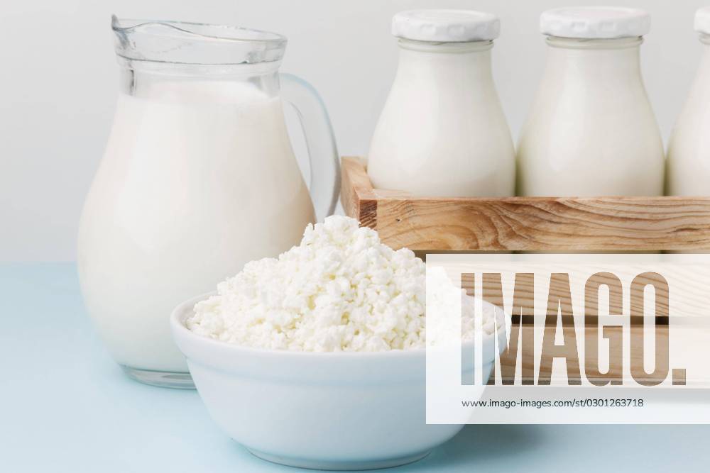 Close-up Milk jug with fresh Cottage cheese