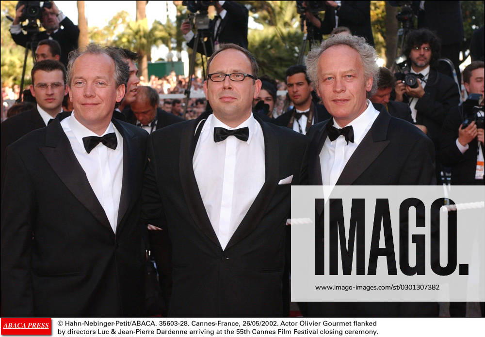35603 28 Hahn-Nebinger-Petit ABACA. 35603-28. Cannes-France, 26 05 2002. Actor Olivier Gourmet flankedby directors Luc & Jean-Pierre Dardenne arriving at the 55th Cannes Film Festival closing ceremony.