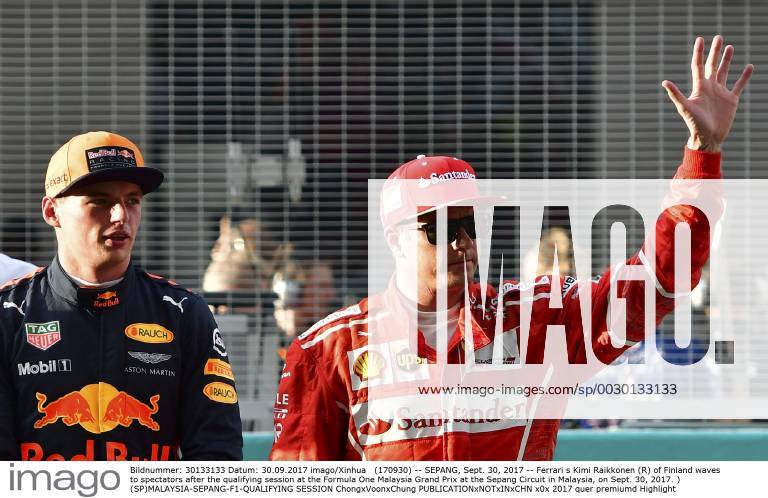 (170930) -- SEPANG, Sept. 30, 2017 -- Ferrari s Kimi Raikkonen (R) of Finland waves to spectators after the qualifying session at the Formula One Malaysia Grand Prix at the Sepang Circuit in Malaysia, on Sept. 30, 2017. ) (SP)MALAYSIA-SEPANG-F1-QUALIFYING SESSION ChongxVoonxChung