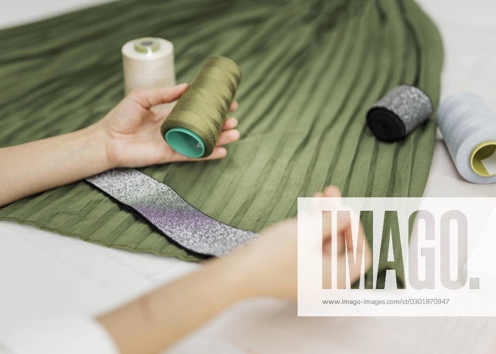 Woman sews manually Rock