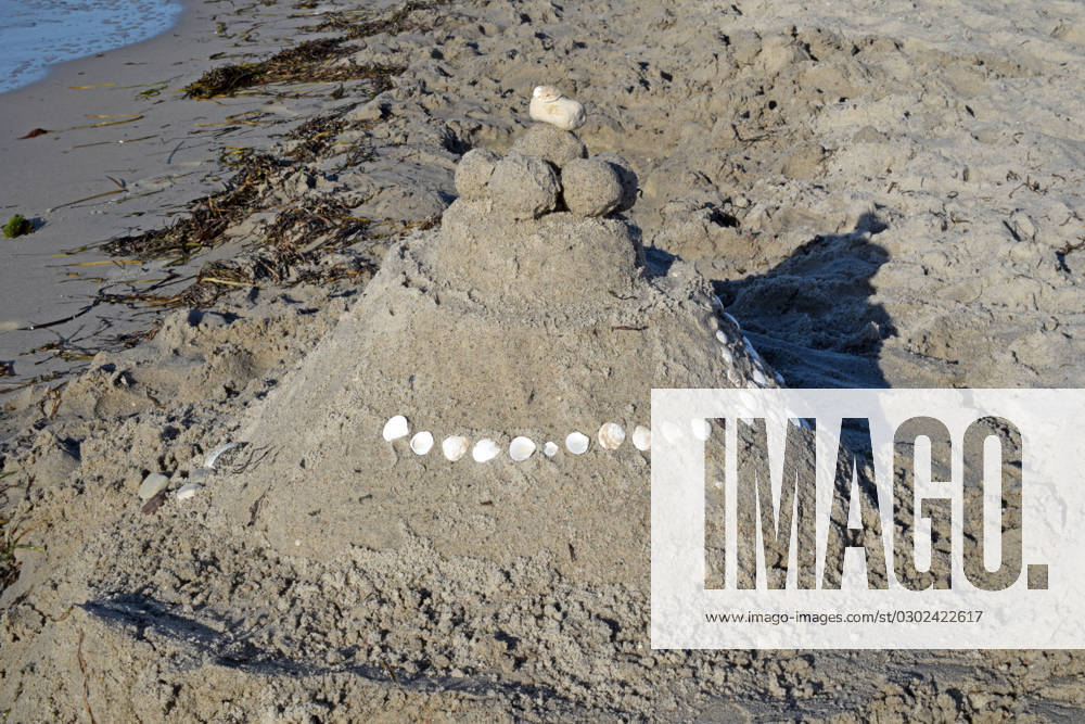island Poel beach art Germany Mecklenburg Vorpommern island Poel Baltic Sea coast on the beach sand beach art sand castle decorated with stones and shells