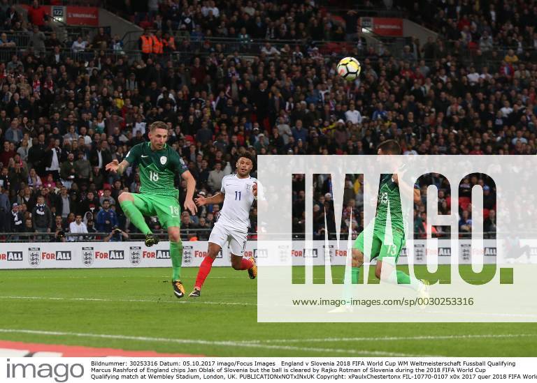 England v Slovenia 2018 FIFA World Cup WM Weltmeisterschaft Fussball Qualifying Marcus Rashford of England chips Jan Oblak of Slovenia but the ball is cleared by Rajko Rotman of Slovenia during the 2018 FIFA World Cup Qualifying match at Wembley Stadium, London, UK. Content Not Available For UK Newspapers