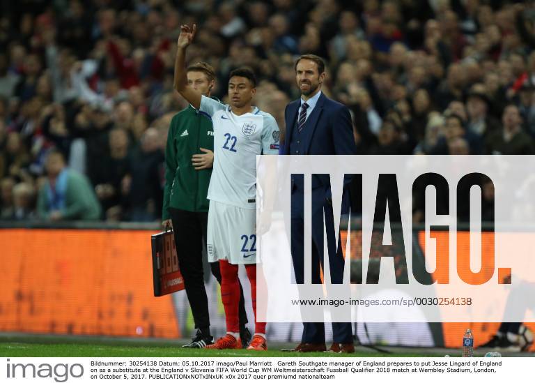 Gareth Southgate manager of England prepares to put Jesse Lingard of England on as a substitute at the England v Slovenia FIFA World Cup WM Weltmeisterschaft Fussball Qualifier 2018 match at Wembley Stadium, London, on October 5, 2017.