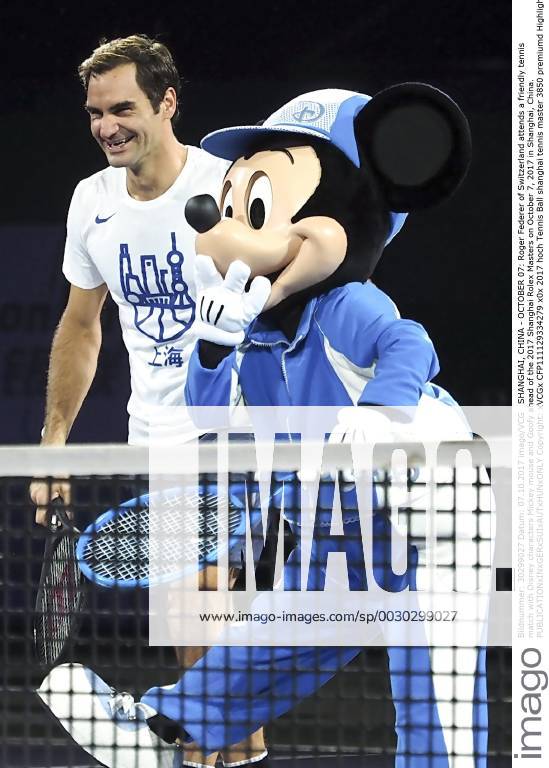 Roger Federer of Switzerland attends a friendly tennis match with Disney characters Mickey mouse and Goofy ahead of the 2017 Shanghai Rolex Masters on October 7, 2017 in Shanghai, China.