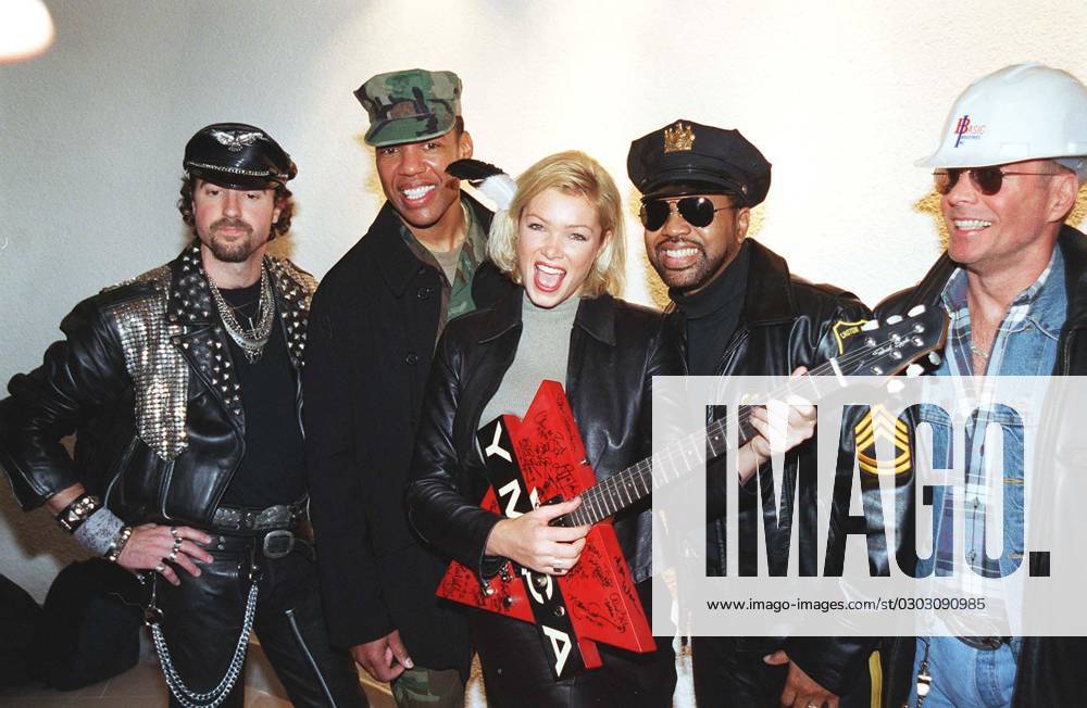NELL McANDREW British Model and TV Personality (with guitar) Pictured with THE VILLAGE PEOPLE 1970 s American Pop Group Seen at the launch for the re-release of one of The Village People s biggest hits YMCA , royalties from which will be donated t NELL McANDREW British Model and TV Personality (with guitar) Pictured with THE VILLAGE PEOPLE 1970 s American Pop Group Seen at the launch for the re-release of one of The Village People s biggest hits YMCA , royalties from which will be donated to a YMCA charity. COMPULSORY CREDIT: Starstock Photoshot Photo UHY 016838 C-27a 22.11.1999, Credit:Photoshot Avalon United Kingdom