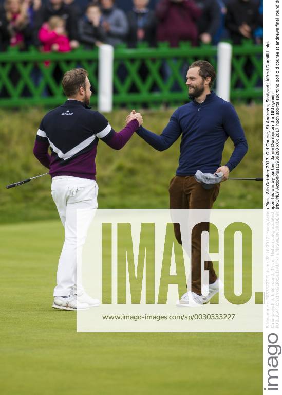 8th October 2017, Old Course, St Andrews, Scotland; Alfred Dunhill Links Championship, final round; Tyrrell Hatton congratulated upon his win by partner Jamie Dornan on the 18th green ActionPlus11939288