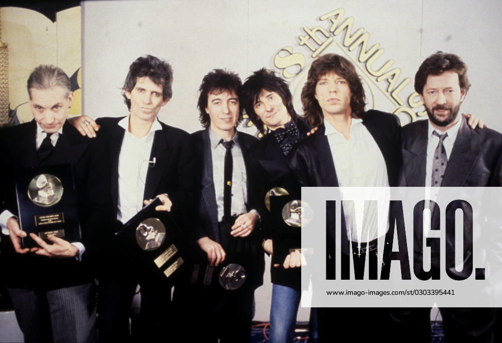 The Rolling Stones The Rolling Stones (l-r) Charlie Watts, Keith Richards, Bill Wyman, Ronnie Wood and Mick Jagger, with Eric Clapton , Credit:Michael Putland Avalon