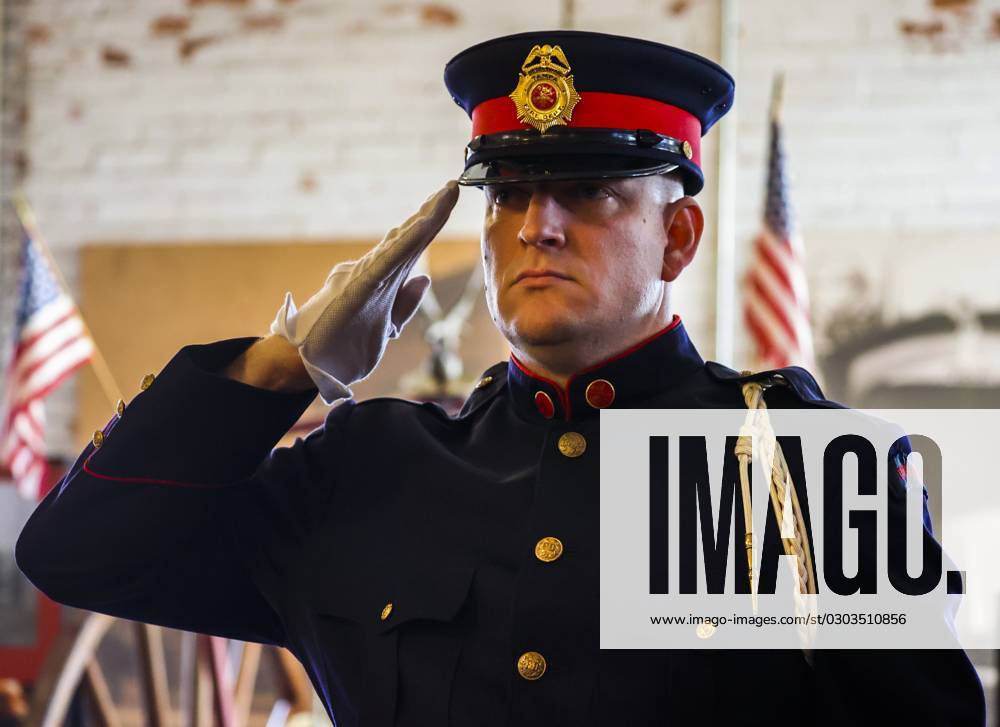Tampa Fire Rescue Lieutenant Charles Shuff raises his hand to salute as the honor guard presents the colors at the Tampa Fire Rescue 9 11 Memorial Ceremony.at the Tampa Firefighters Museum, 720 E. Zack St., on Monday, Sept. 11, 2023 in Tampa. On the occasion of the 22nd anniversary of the September 11th attacks, Tampa.Fire Rescue and Tampa Police Department will held a joint memorial ceremony to honor the memory of the victims and pay tribute to the heroic first responders.who demonstrated extraordinary bravery in the face of danger. Tampa USA - ZUMAs70_ 20230911_zan_s70_006