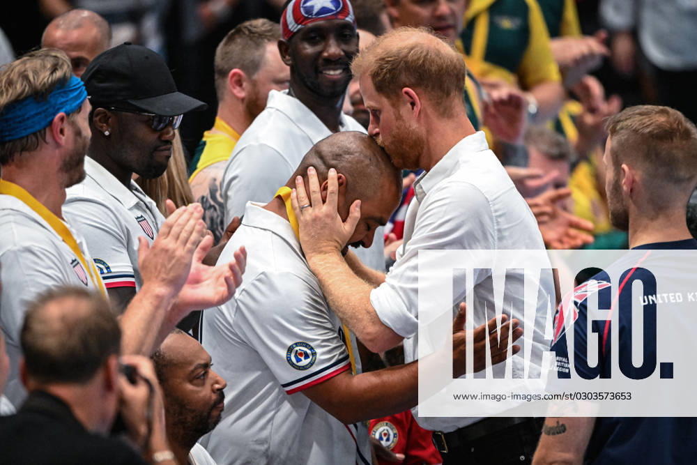 Prince Harry watches UK vs USA wheelchair rugby final, Invictus Games Day 2, Düsseldorf, Germany Düsseldorf, Germany, 11th Sep 2023. Harry hugs one of the Team US players before handing him his medal. The Duke of Sussex, Prince Harry watches the game and interacts with invitees, fans, children and even a UK athlete s sausage dog, before handing Team USA their gold medals after their win. Team United Kingdom play Team USA in the wheelchair rugby finals at the Spiel Merkur arena this evening. Day 2 of the Invictus Games Düsseldorf in and around the Merkur Spiel Arena., Credit:Imageplotter Avalon