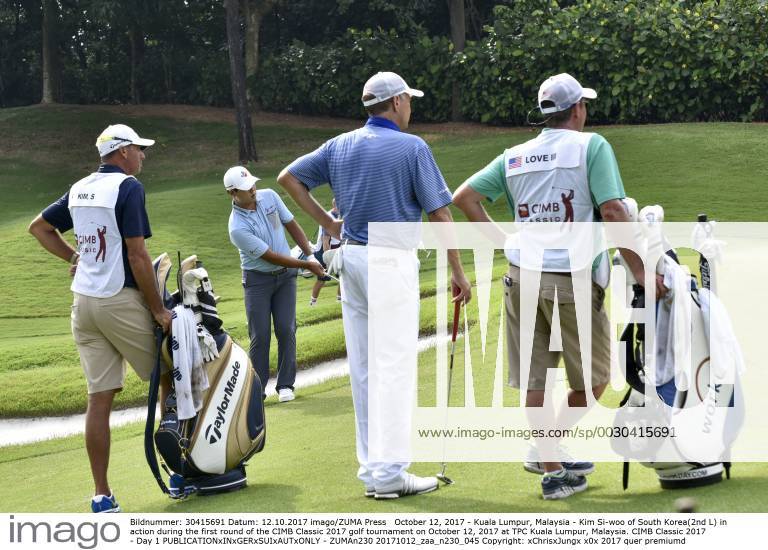 Kuala Lumpur, Malaysia - Kim Si-woo of South Korea(2nd L) in action during the first round of the CIMB Classic 2017 golf tournament on October 12, 2017 at TPC Kuala Lumpur, Malaysia. CIMB Classic 2017 - Day 1 - ZUMAn230 20171012_zaa_n230_045
