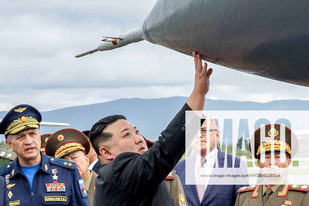 RUSSIA, PRIMORYE REGION - SEPTEMBER 16, 2023: Sergei Kobylash (L), commander of the Russian Aerospace Forces Long-Range Aviation, and North Korea s Supreme Leader Kim Jong Un (C) are seen at Vladivostok International Airport. Vadim Savitsky Russian Defence Ministry Press Office TASS 62226167