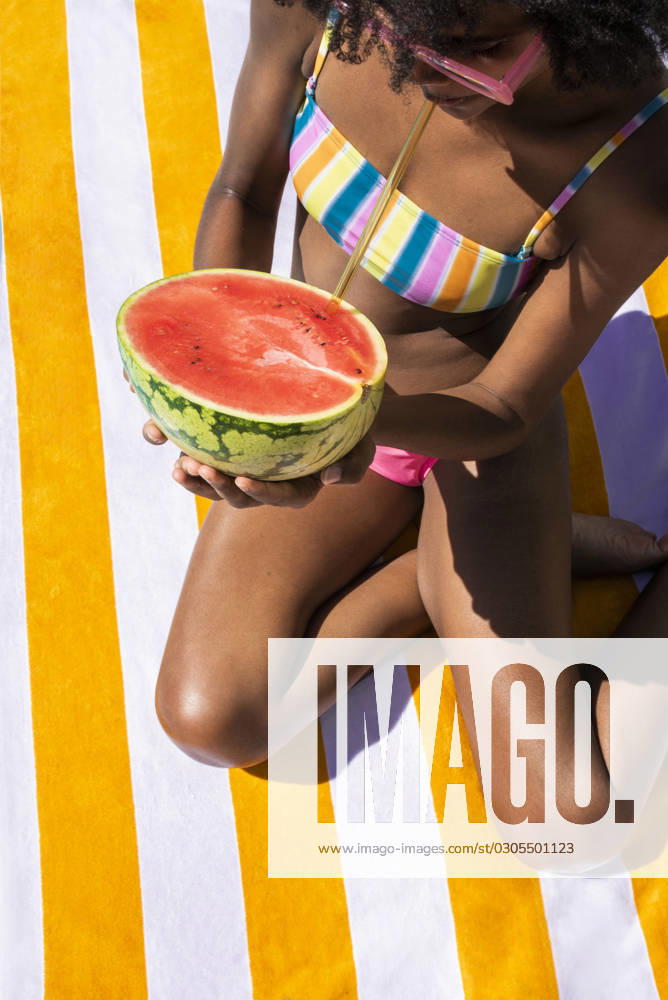 Woman drinking watermelon juice on sunny day model released, Symbolfoto, VRAF00184