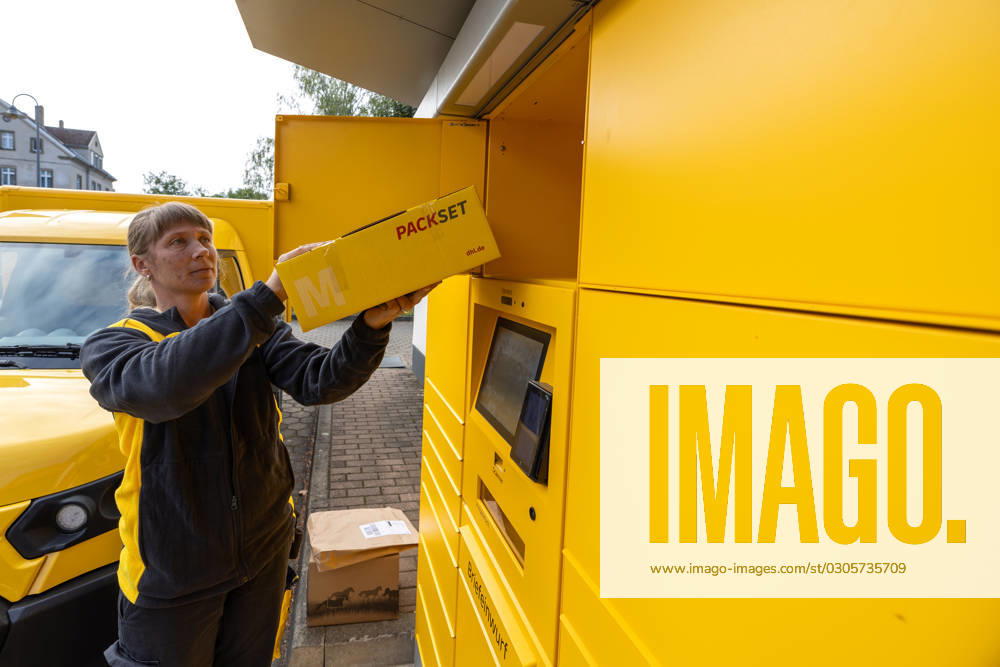 Parcels and letters at the postal station A postwoman removes a parcel Returned items at a postal station in Meissen, Saxony At this location, letters can be posted as well as parcels Meissen Saxony Germany Daniel Schäfer