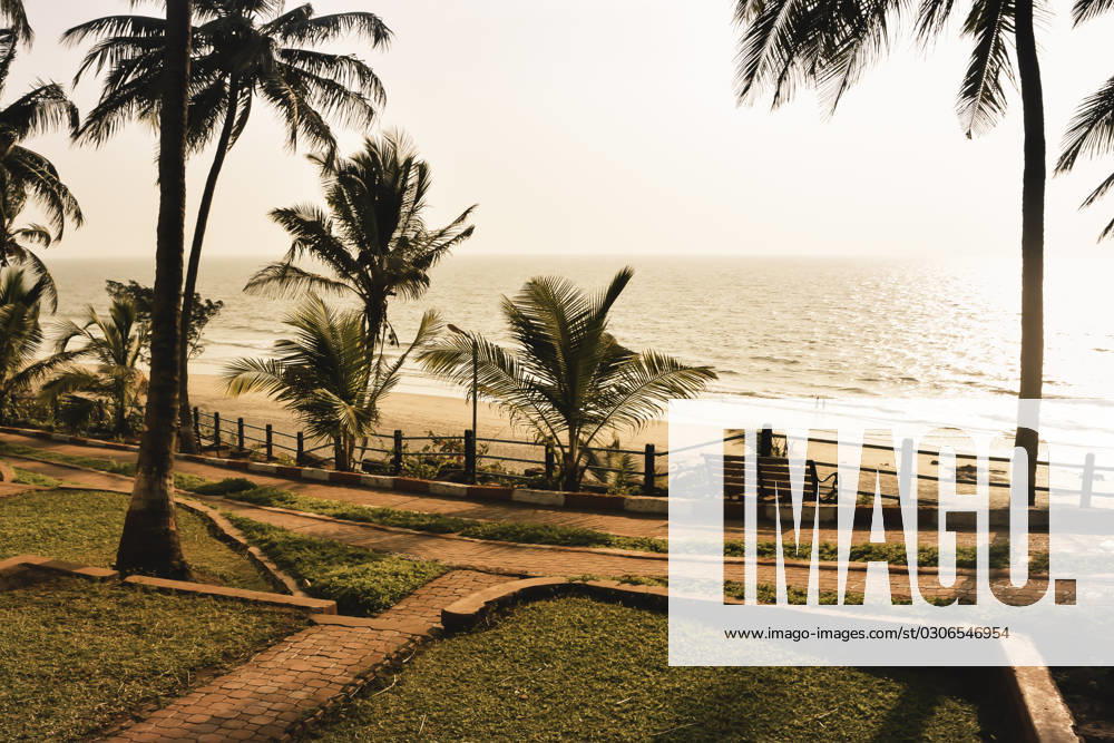 Panorama landscape view of a beautiful tropical sea beach in sunset time during christmas holiday. ( MUMBAI, MAHARASTRA, INDIA). Travel vacation and holiday concept. , 27404336.jpg, silhouette, vacation, sunrise, resort, summer, sun, sky, paradise, palm-tree, travel, coconut, orange, nature, exotic, dusk, trees, yellow, island, ocean, evening, background, light, twilight, sunlight, scenery, tranquil, scene, water, leaf, sundown, golden, caribbean, maldives, tropic, coastal-sand, thailand, holiday, colorful, shore-coast, asia, lagoon, miami, hawaii, islands, bali, morning, lucia, bahamas, jamaica, wave, RECORD DATE NOT STATED
