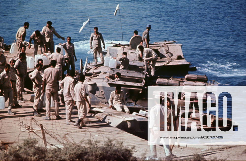 Oct 1, 1973 - Suez Canal, Israel - Soldiers at Suez Canal during the Yom Kippur War. Also known as the Fourth Arab-Israeli War, Yom Kippur War was fought from October 6 to October 26, 1973 by a coalition of Arab states led by Egypt and Syria against Israel. The war began with a surprise joint attack by Egypt and Syria on the Jewish holiday of Yom Kippur. Egypt and Syria crossed the cease-fire lines in the Sinai and Golan Heights, respectively, which had been captured by Israel in 1967 during the Six-Day War. Many Arab states contributed troops and financial support, and the USSR also provided assistance but ultimately the Arabs buckled under a sustained Israeli counter-attack strengthened by US airlifts. Suez Canal Israel - ZUMAk98_ 19731001_nin_k98_795