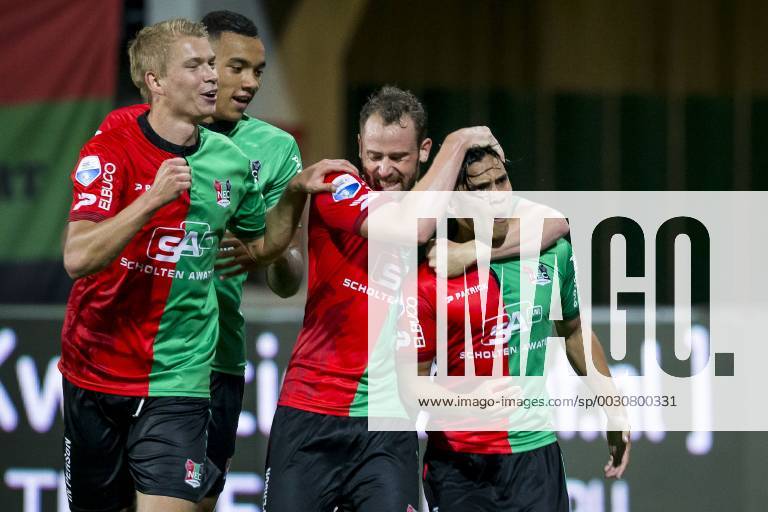 Nijmegen NEC Excelsior Football Eredivsie season 2015 2016 12 08 2015 Stadium the Goffert NEC player Navarone Foor R has the 1 0 scored NEC player Kristjan Emilsson L NEC player Jay roy cave 2L NEC player Bart Buysse 2R NEC Excelsior