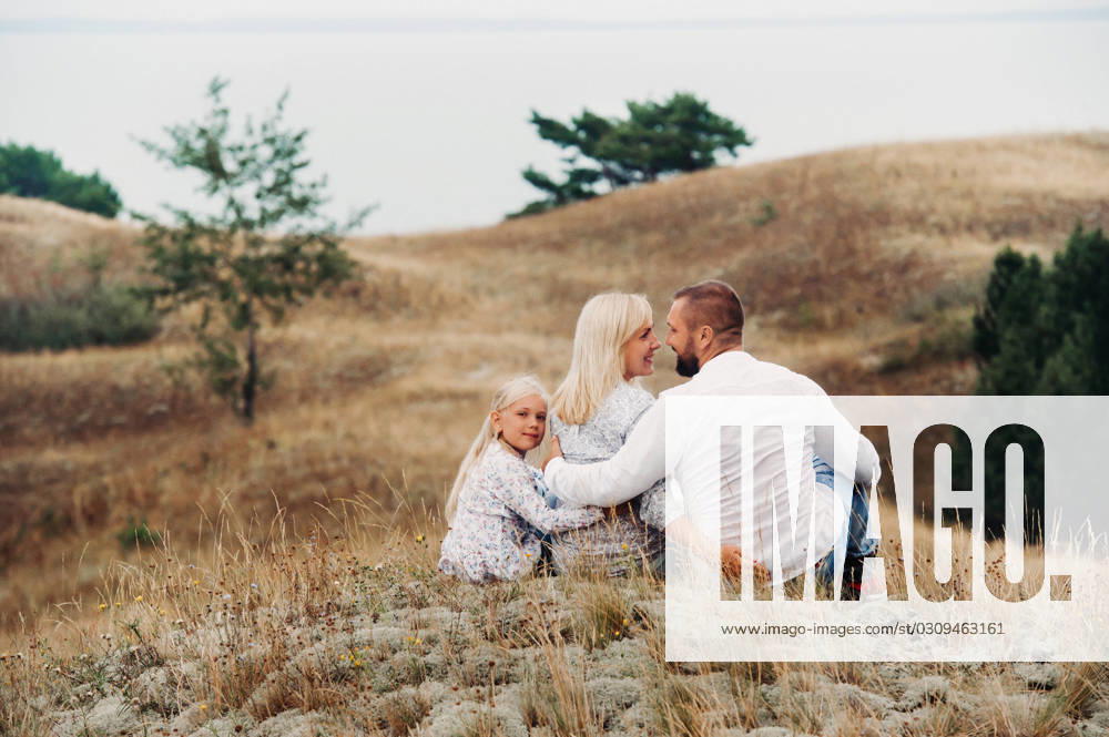 A happy family of three on the sand dunes of the Baltic sea near the city of Nida.Lithuania., model released, , 40211446.jpg, family, young, vacation, travel, city, together, shooting, selfie, self-portrait, photography, people, outdoor, lifestyle, Europe, happy, tourism, camera, Lithuania, dunes, dead dunes, father, taking, photo, smart, smile, social, adult, trip, view, water, tourist, fun, youth, summer, outside, holiday, enjoy, person, mobile, nature, parent, day, dad, happiness, phone RECORD DATE NOT STATED