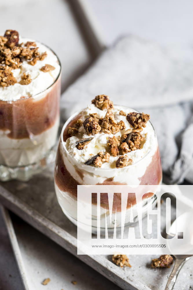Glasses of healthy sugarfree mascarpone dessert with yogurt, rhubarb and granola, SBDF04632