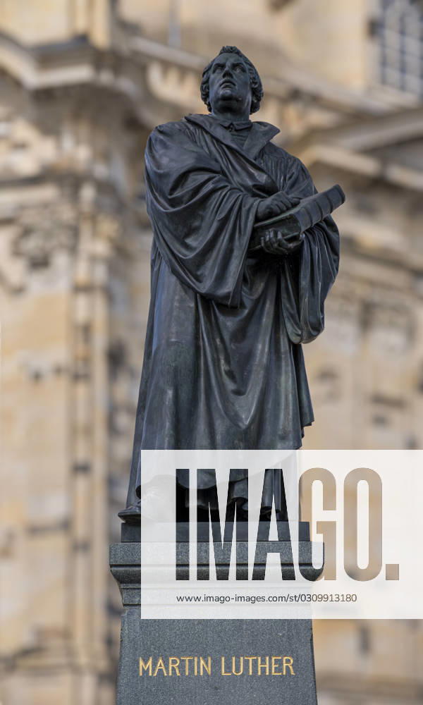 Monument to the reformer Martin Luther 1483 1546 with a Bible in his hand in front of the Church of Our Lady at Neumarkt in Dresden On October 31, Protestant Christians celebrate Reformation Day Martin Luther is said to have slammed his church-critical 95 Theses on the door of the Castle Church in Wittenberg Saxony An