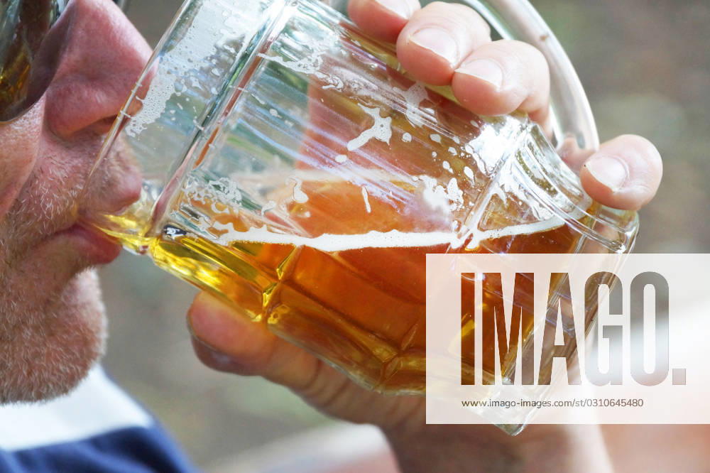 Man drinks beer from a large glass mug in nature, close-up, model released, , 32773688.jpg, golden, lifestyle, senior, male, beer garden, germany, festival, traditional, beer mug, beer glass, alcoholism, portrait, bubbles, gold, craft, oktoberfest, glass, alcohol, beer, mug, adult, drink, man, pub, pint, person, people, beverage, party, celebration, brew, celebrate, alcoholic, lager, tradition, bar, summer, guy, cold, happy, caucasian, background, face, men, white, young RECORD DATE NOT STATED
