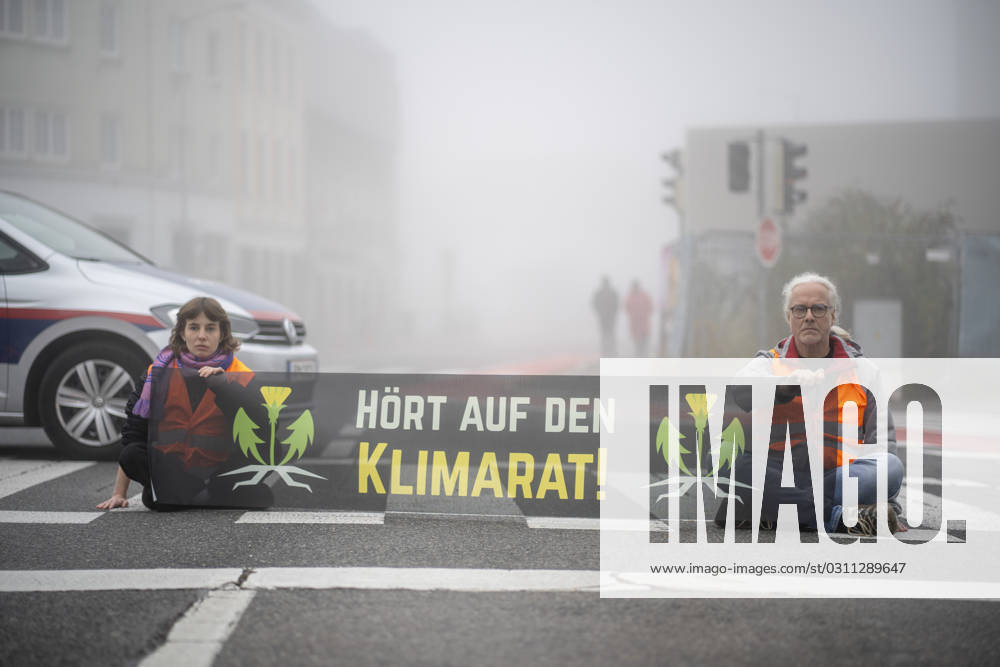St Pölten, Austria 30 October 2023 Members of the Last Generation Austria block the early morning traffic in the capital of Lower Austria to demand more climate protection of the Lower Austrian government