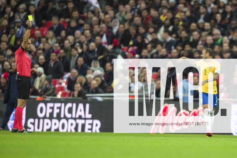 Dani Alves of Brazil see s the funny side after receiving a caution from Match Referee Artur Manuel Ribeiro during the International Friendly Länderspiel match between England and Brazil at Wembley Stadium, London, England on 14 November 2017.