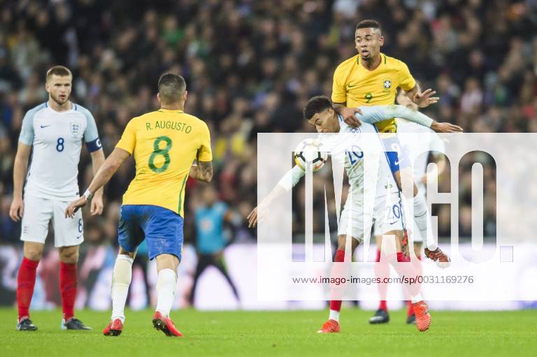 Jesse Lingard of England is challenged by Gabriel Jesus of Brazil during the International Friendly Länderspiel match between England and Brazil at Wembley Stadium, London, England on 14 November 2017.