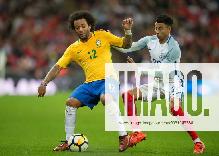 Marcelo of Brazil and Jesse Lingard of England battle for possession during the International Friendly Länderspiel match between England and Brazil at Wembley Stadium, London, England on 14 November 2017.