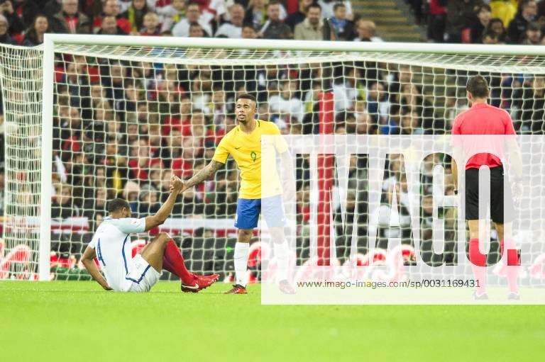 Gabriel Jesus of Brazil picks up Joe Gomez of England after fouling him during the International Friendly Länderspiel match between England and Brazil at Wembley Stadium, London, England on 14 November 2017.