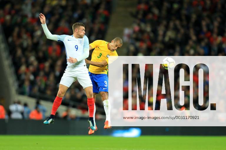 14th November 2017, Wembley Stadium, London, England; International football friendly, England versus Brazil; Miranda of Brazil battles to win a header against Jamie Vardy of England ActionPlus11951525