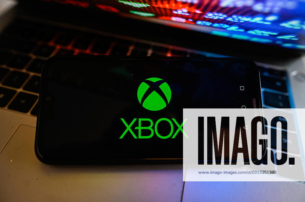 Tech illustrations in Poland - 03 Nov 2023 In this photo illustration, a Xbox logo is displayed on a smartphone with stock market percentages on the background. Poland