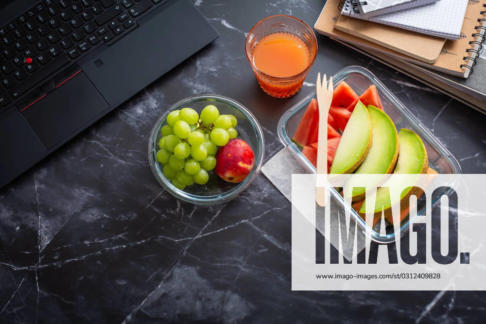 Healthy snack at office workplace Healthy snack at office workplace, organic vegan meals from take away lunch box
