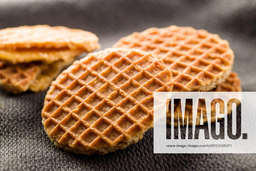 Sweet waffle biscuits. Sweet waffle biscuits on tablecloth.