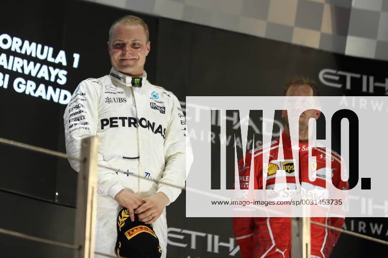 26th November 2017, Yas Marina Circuit, Abu Dhabi, UAE; Abu Dhabi Formula One Grand Prix, Sunday race day; Valtteri Bottas - Mercedes AMG Petronas F1 Team wins the race talks with Sebastian Vettel - Scuderia Ferrari ActionPlus11956621