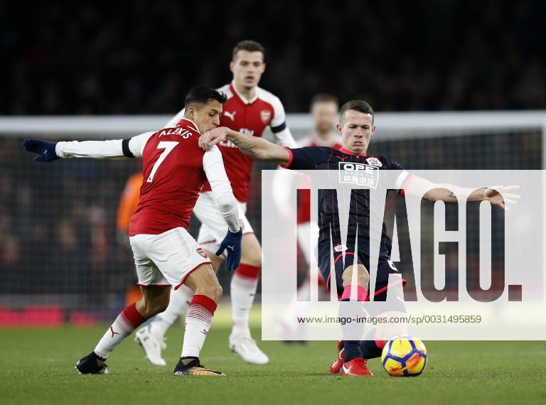 Arsenal s Alexis Sanchez tussles with Huddersfield s Jonathan Hogg during the premier league match at the Emirates Stadium, London. Picture date 29th November 2017. Picture credit should read: David Klein Sportimage .