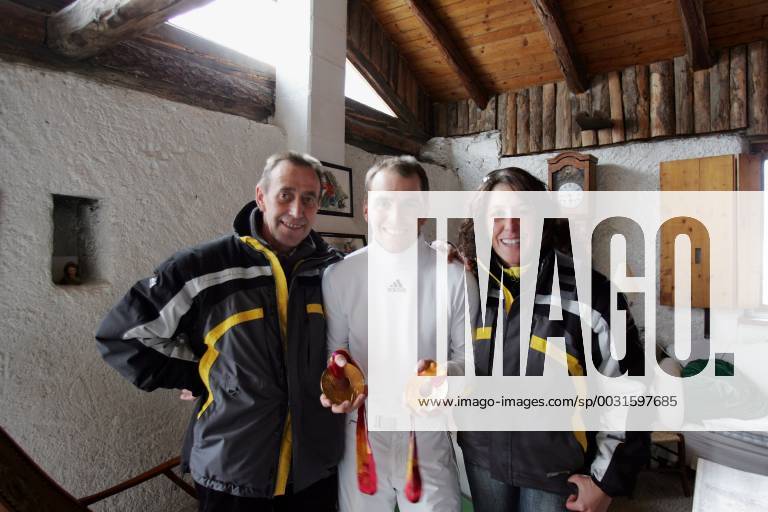 Michael Greis with 3 gold medals most successful athlete in the Olympic Games of Turin lived during the competitions in a rustic Italian farm about 500 metres from the biathlon Stadium located here is he with his father and his sister Isabelle San Sicario Italy